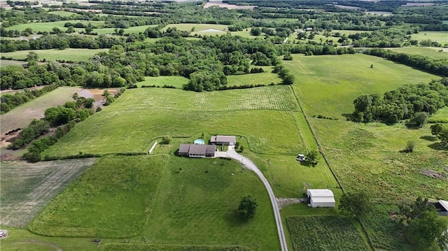 birds eye view of property with a rural view