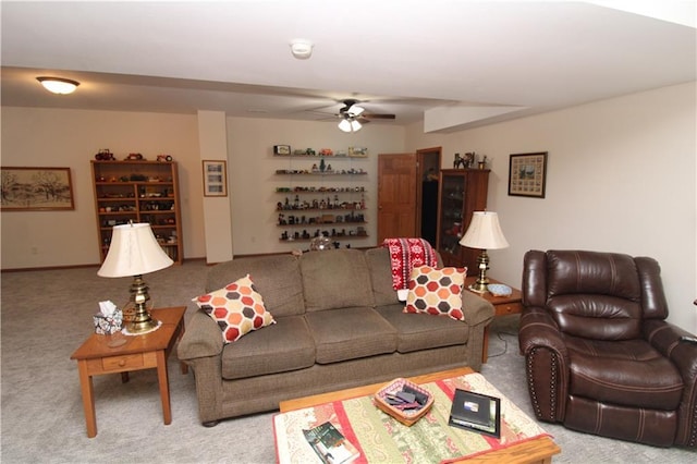 living room featuring light carpet and ceiling fan