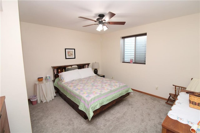 bedroom with light carpet, ceiling fan, and baseboards