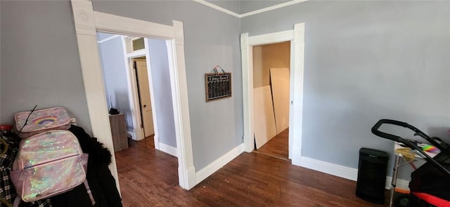 interior space featuring dark hardwood / wood-style floors and ornamental molding