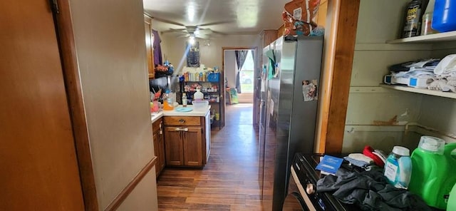 kitchen with dark hardwood / wood-style floors, stainless steel fridge, and ceiling fan