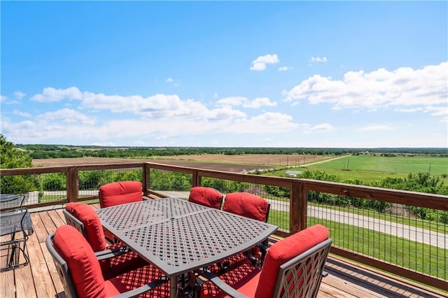 wooden terrace featuring a rural view