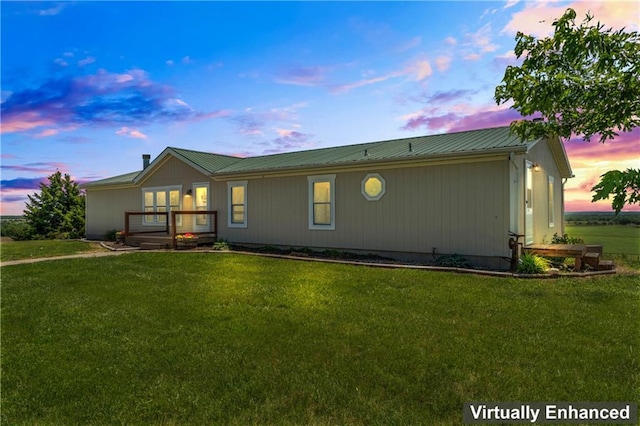 view of front of house with a yard