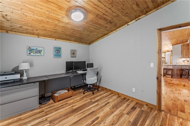 office area with lofted ceiling, ornamental molding, light hardwood / wood-style flooring, and wooden ceiling