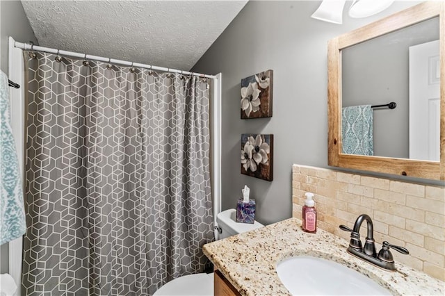 bathroom with decorative backsplash, vanity, toilet, a textured ceiling, and a shower with curtain