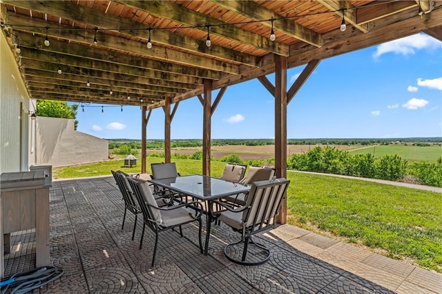 view of patio / terrace with a rural view