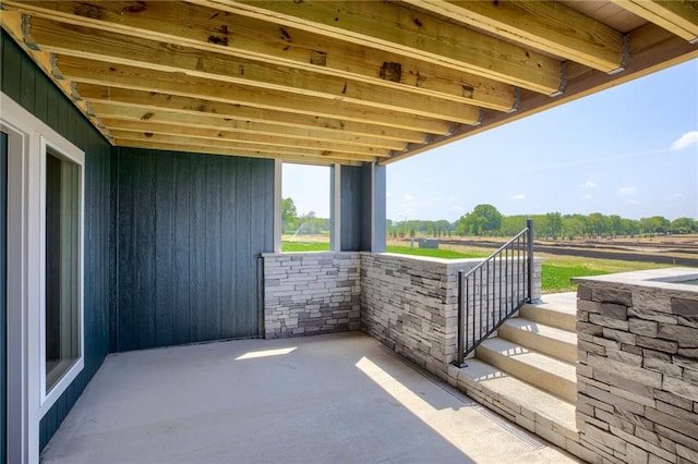 view of patio / terrace with a rural view