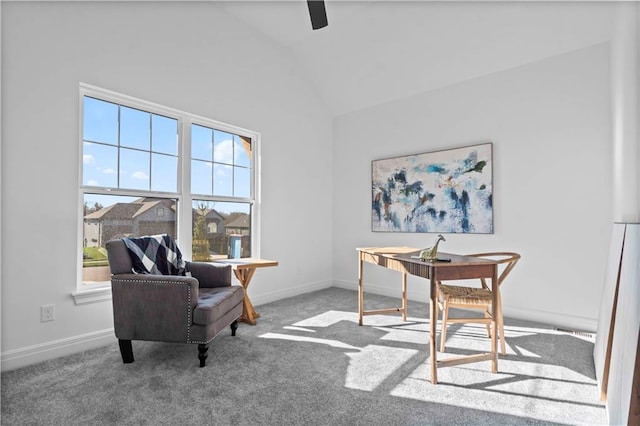 office space with vaulted ceiling and light colored carpet