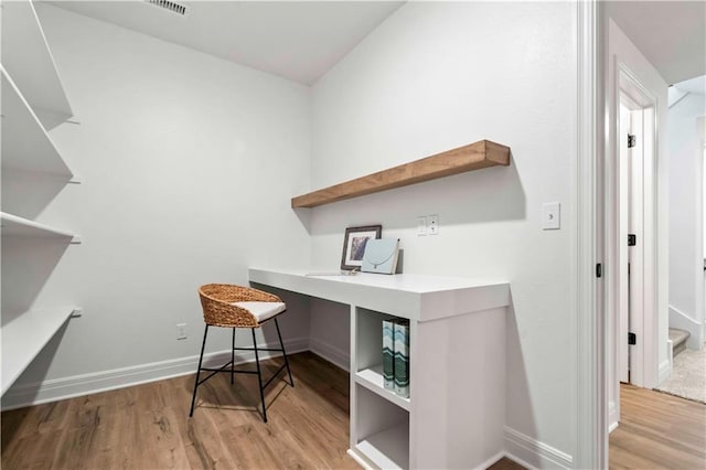 home office featuring light hardwood / wood-style floors