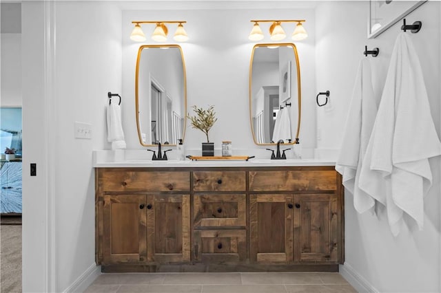 bathroom with tile patterned floors and vanity