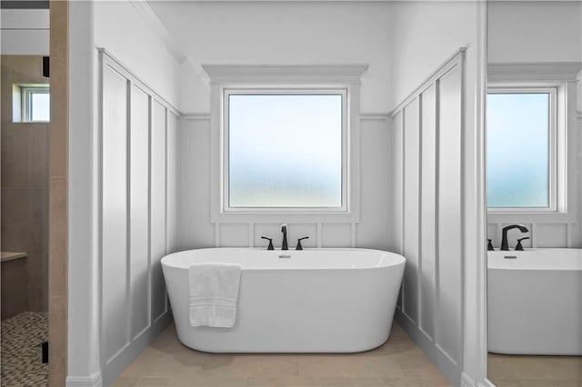 bathroom featuring a healthy amount of sunlight, tile patterned flooring, and shower with separate bathtub