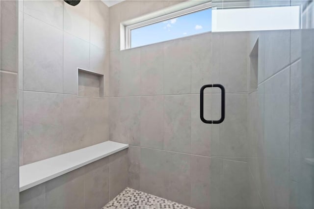 bathroom featuring an enclosed shower