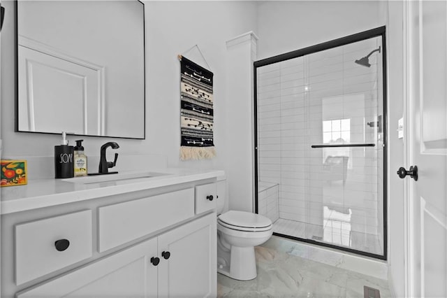 bathroom with a shower with shower door, toilet, and vanity