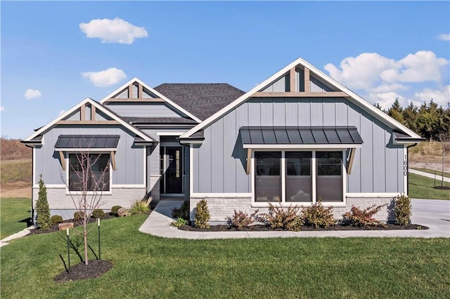 modern inspired farmhouse featuring a front lawn