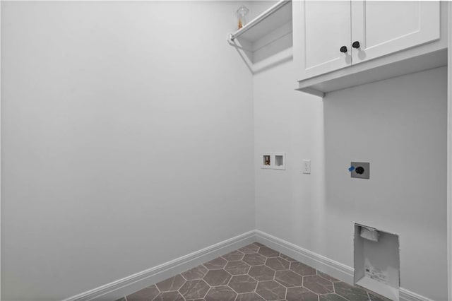 1600 SW 27th St, Lees Summit, MO 64082 - laundry area with cabinet space, hookup for a washing machine, electric dryer hookup, baseboards, and dark tile patterned floors