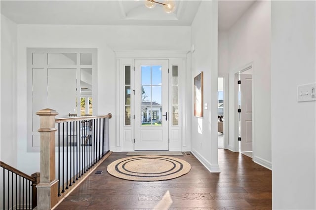 foyer with dark hardwood / wood-style floors