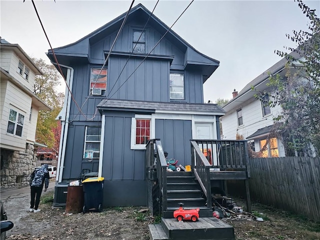 back of house with cooling unit