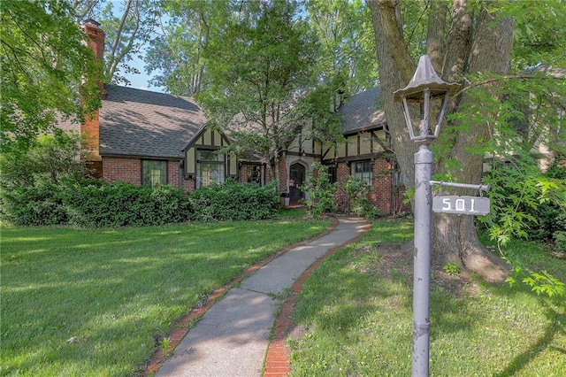 tudor house with a front yard