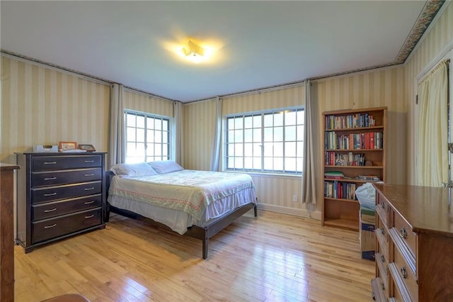 bedroom with light hardwood / wood-style flooring