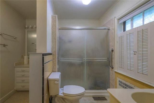 bathroom with tile patterned flooring, vanity, an enclosed shower, and ornamental molding