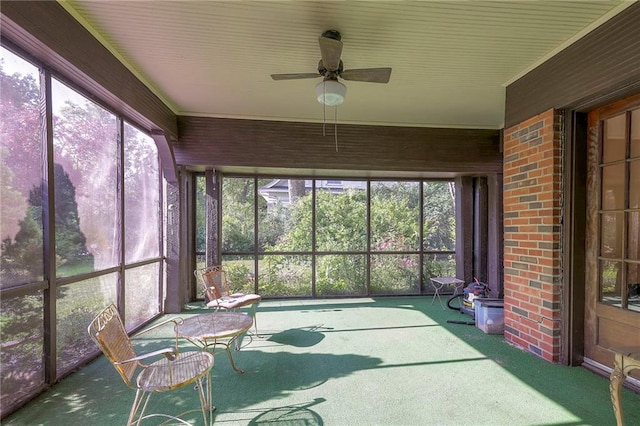 sunroom / solarium with ceiling fan and a healthy amount of sunlight