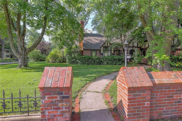 view of home's community featuring a yard