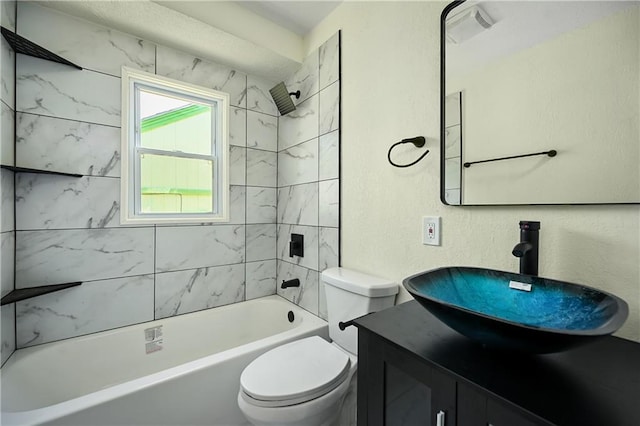 full bathroom featuring vanity, toilet, and tiled shower / bath