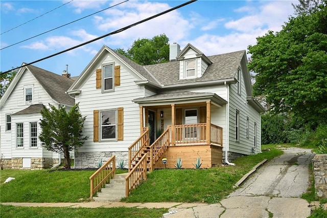 view of front of house with a front lawn and a porch