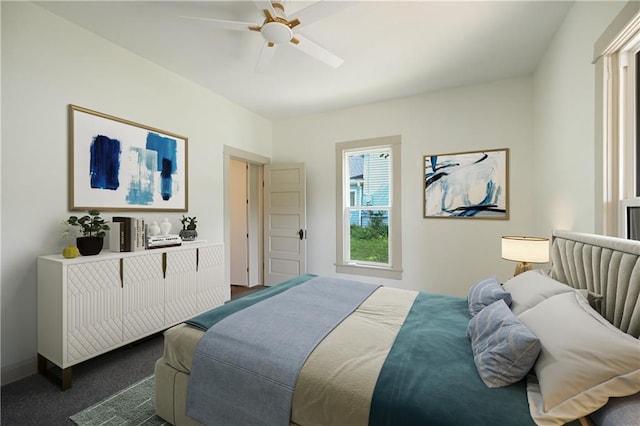 carpeted bedroom featuring ceiling fan