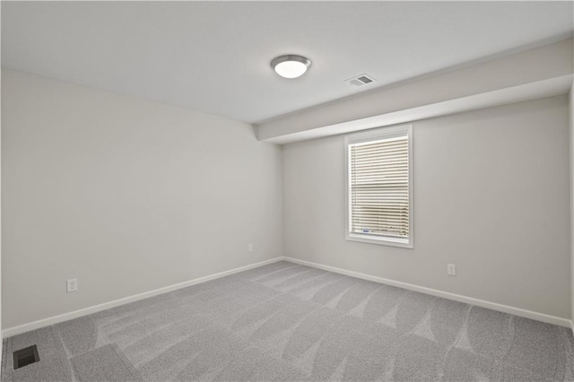 unfurnished room with carpet floors