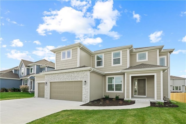 view of front of home featuring a front yard and a garage