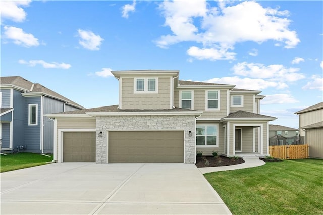 view of front of property with a front lawn and a garage