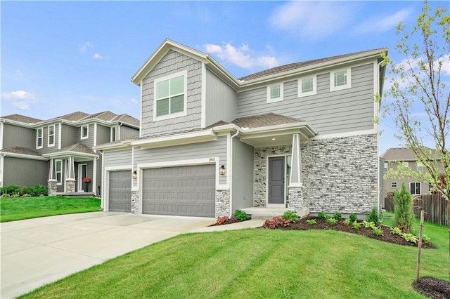 view of front of house with a garage and a front yard