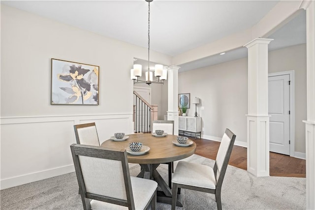 carpeted dining space featuring an inviting chandelier