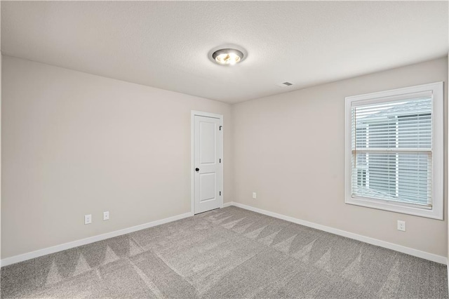 unfurnished room featuring carpet floors