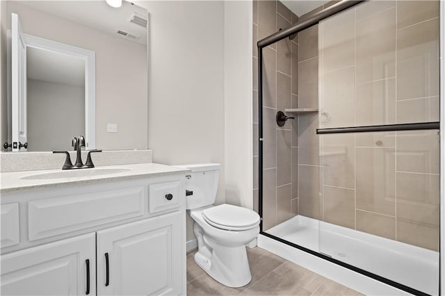 bathroom with vanity, toilet, and walk in shower