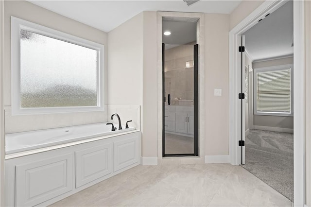 bathroom with separate shower and tub