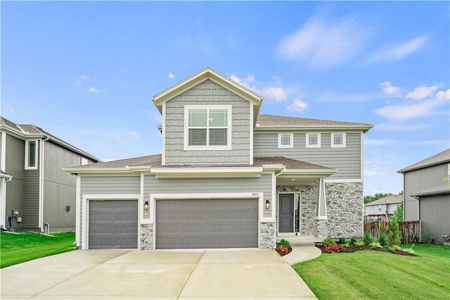 view of front facade with a front yard and a garage