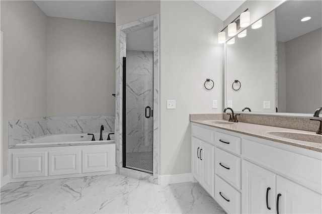 bathroom featuring vanity and independent shower and bath