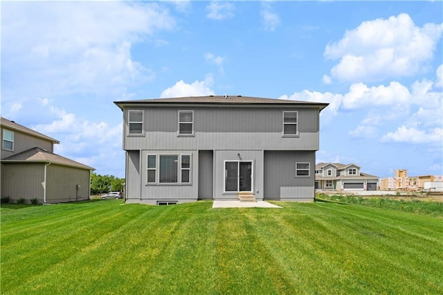 back of house featuring a yard