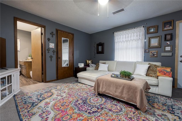 carpeted living room featuring a textured ceiling