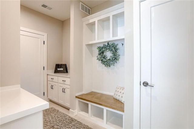 mudroom with light tile patterned floors