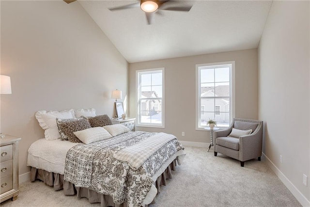 bedroom with ceiling fan, light colored carpet, and lofted ceiling