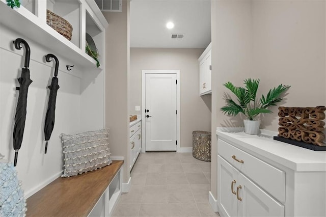 mudroom with light tile patterned flooring