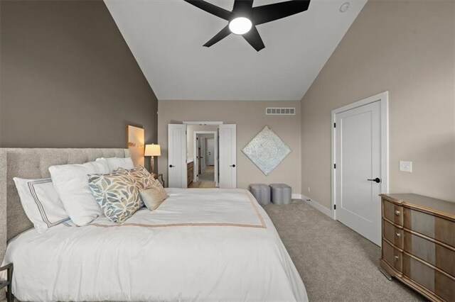 bedroom featuring carpet, ceiling fan, and vaulted ceiling