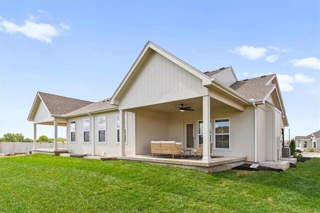 back of property with a lawn, ceiling fan, an outdoor hangout area, and a patio