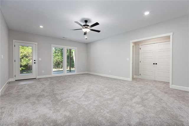 carpeted empty room with ceiling fan