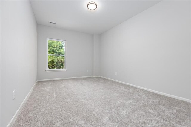 unfurnished room featuring carpet floors