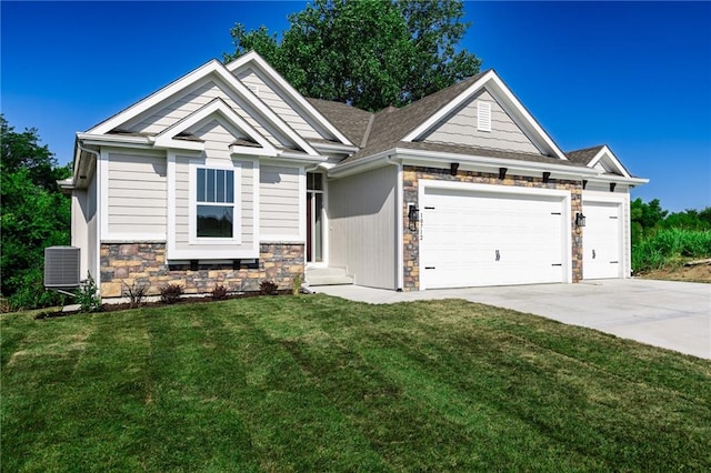 craftsman-style house with a front lawn, central air condition unit, and a garage