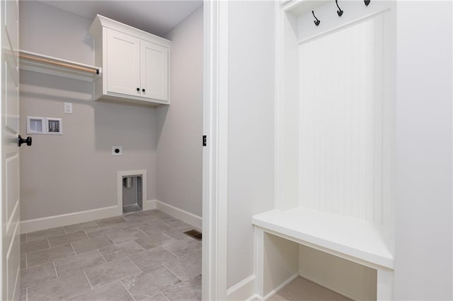 laundry room with hookup for a washing machine, hookup for an electric dryer, cabinets, and light tile patterned floors